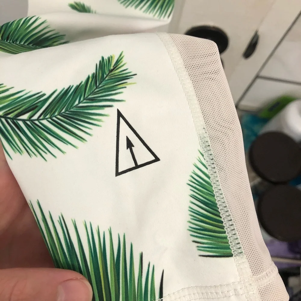 SLINKII 🌿 white tropics leggings size small